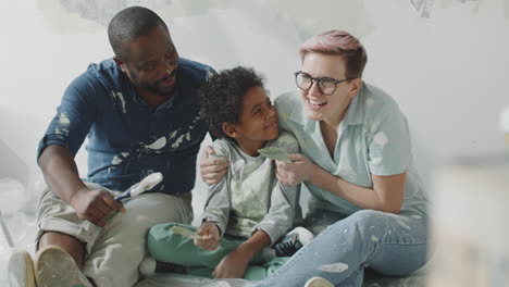 family painting a room together