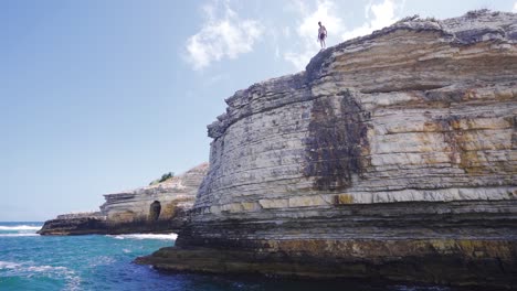 jumping from cliff into sea in slow motion.