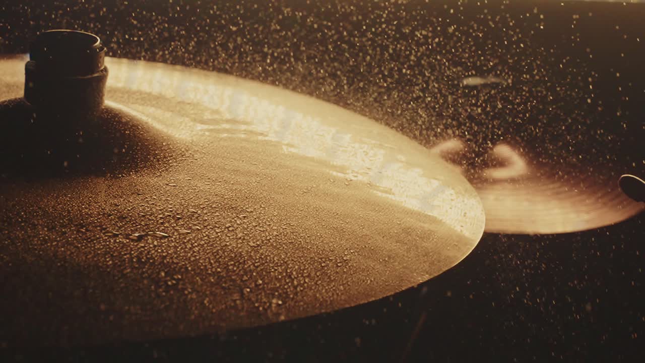 Close-up of wet cymbals on a drum set
