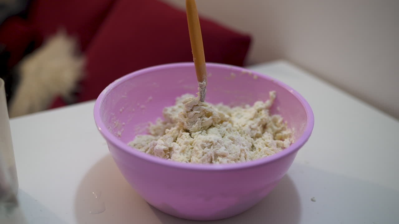 Close-up of bowl of flour for preparing Reviro, traditional food ingredients