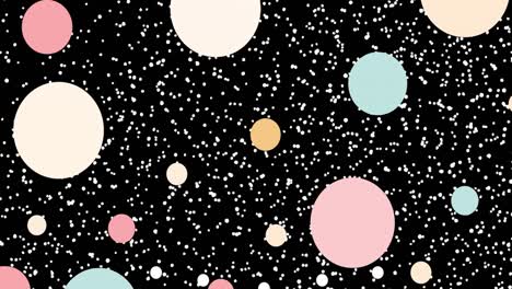 animation of pastel coloured circles and white particles moving on black background