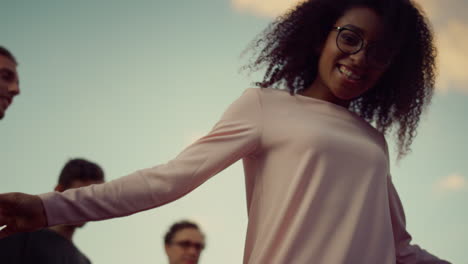 Afro-girl-jumping-to-music-at-party.-Pretty-african-dancer-posing-camera.