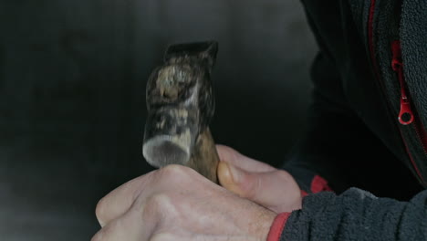 man using a hammer