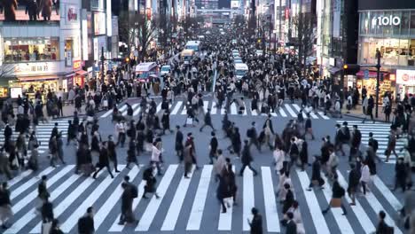 a vibrant urban crossing: capturing the dynamic flow of pedestrians in a busy city intersection amidst the bustling streets