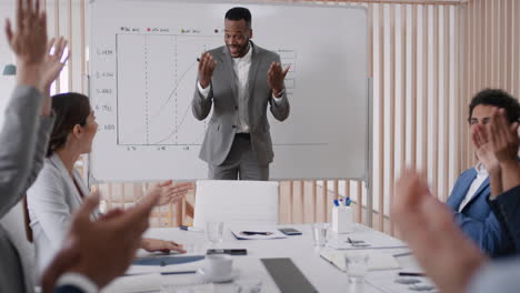 happy-business-people-celebrating-success-in-boardroom-meeting-enjoying-corporate-victory-colleagues-high-five-in-office-presentation