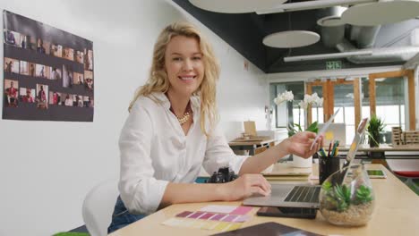 young woman working in a creative office