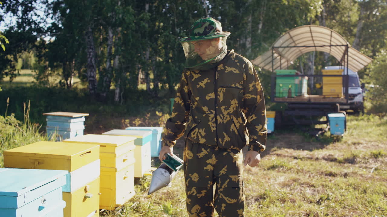 Beekeeper working in an apiary