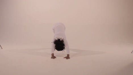 A-Black-yogini-transitions-from-upward-dog-to-downward-dog