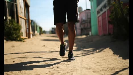 african american male runner jogging near beach 4k