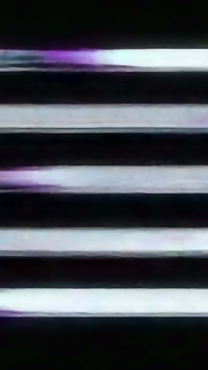 Vertical video: Stripes flickering at five second, glitching into jagged bands on digital screen