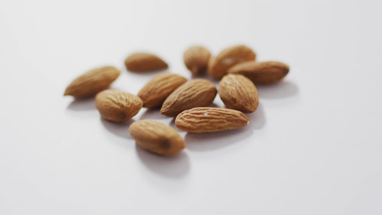 Video of almonds on white background