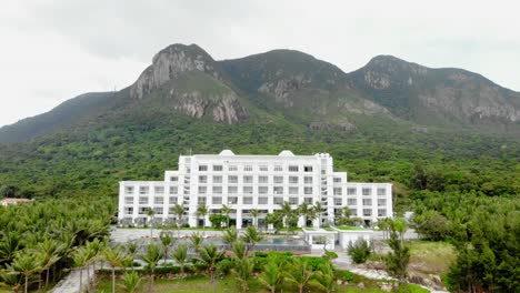 Aerial-shot-of-Orson-Hotel-And-Resort-Surrounded-By-Lush-Greenery-In-Con-Dao,-Vietnam