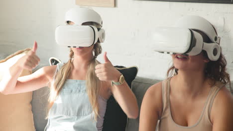 diverse female friends enjoying virtual reality experience on couch, smiling and laughing, at home
