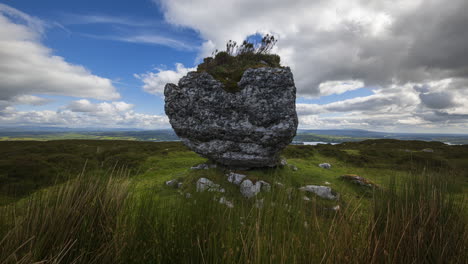 Time-lapse-of-rural-and-remote-landscape-of-grass,-trees-and-rocks-during-the-day-in-hills-of-Carrowkeel-in-county-Sligo,-Ireland