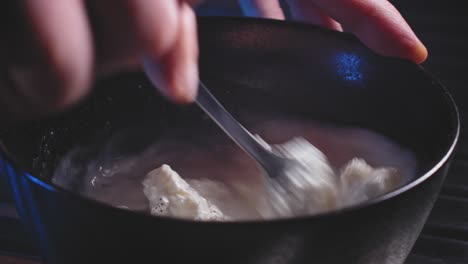 Cooking-Pasta-with-Spinach-and-Cheese---Mixing-the-Cheese-with-Cream