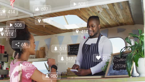 animation of social media icons and numbers over african american man and woman in food truck