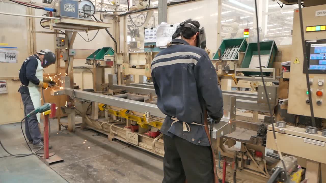 Asian Worker Wear Protection Working in Heavy Metal Factory, Editorial