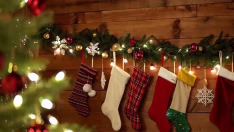 christmas stockings hanging on a wooden wall