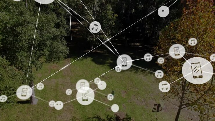 Network of connected devices and data sharing animation over forest landscape
