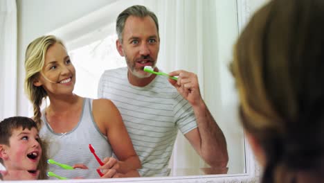 Family-brushing-their-teeth-in-bathroom-4k