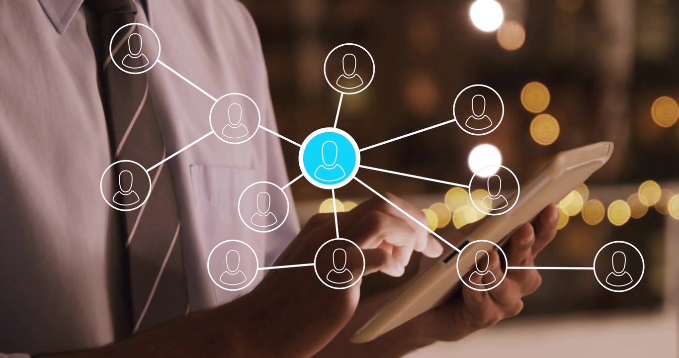 Man tapping tablet, tap causing network fading in, nodes morphing into avatars, browsing contacts