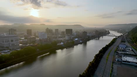 aerial tilt up charleston west virginia skyline at sunrise