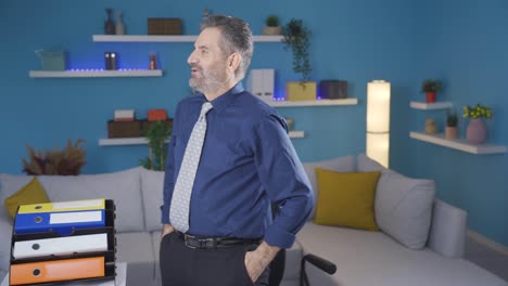 confident successful businessman working in home office, rejoicing in his success, proud of his victory.