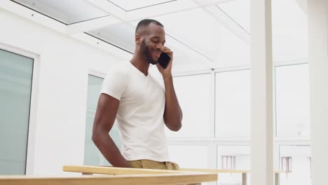 Young-adult-mixed-race-man-enjoying-time-at-home