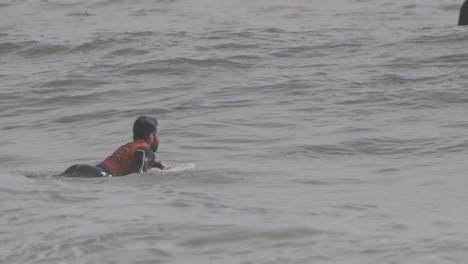 male surfer riding a wave