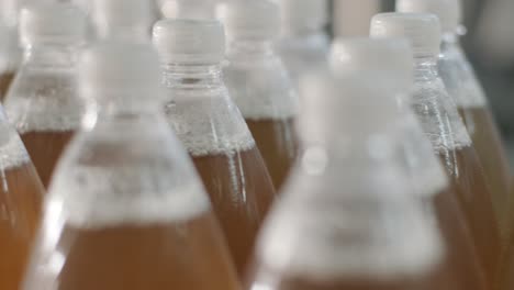 conveyor belt with bottles for juice or water at a modern beverage plant. modern production of sweet soda water