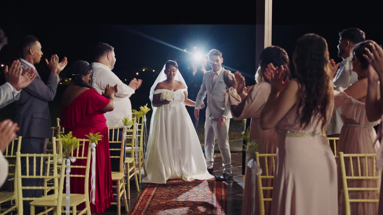 Joyful Bride and Groom Enter Wedding Ceremony at Night