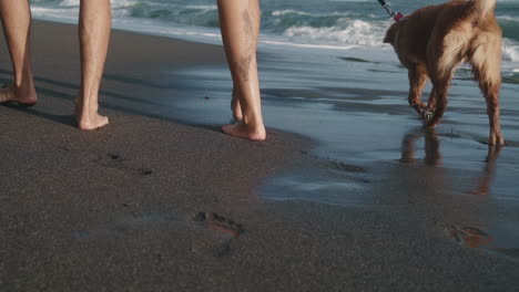 couple leaving footprints on wet sand