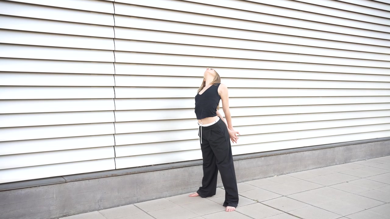 A dynamic dance performance set against a stunning contemporary architectural background
