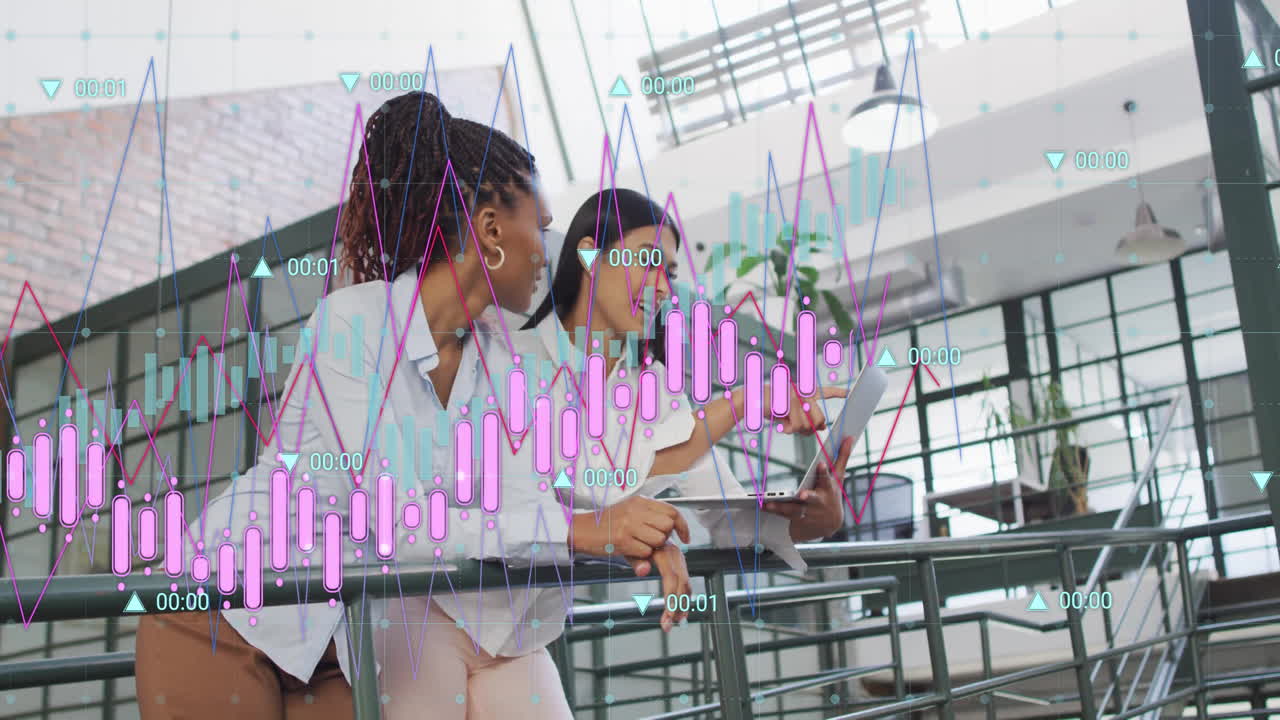 Financial data and analytics animation over diverse businesswomen discussing in modern office