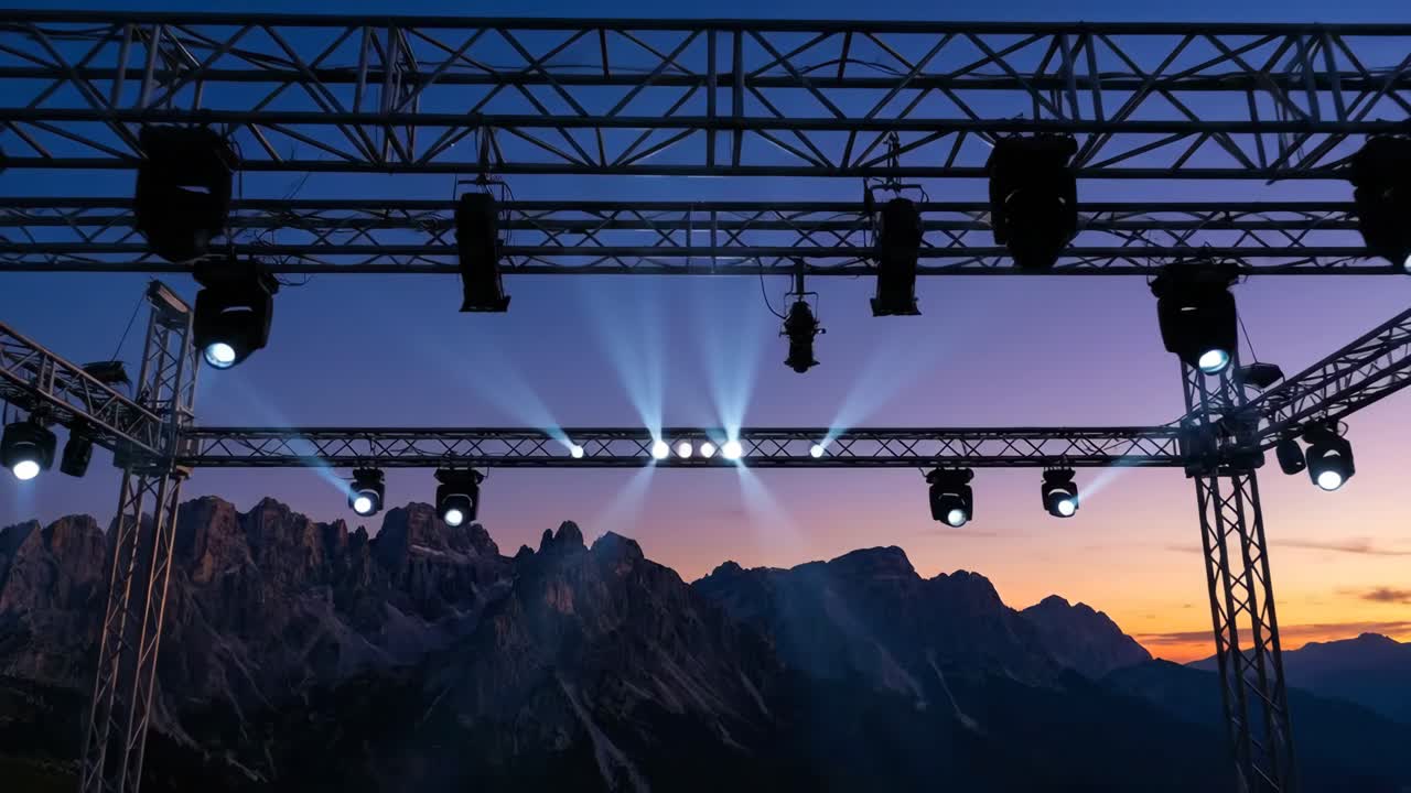 Stage Lighting Illuminating Mountain Landscape at Dusk
