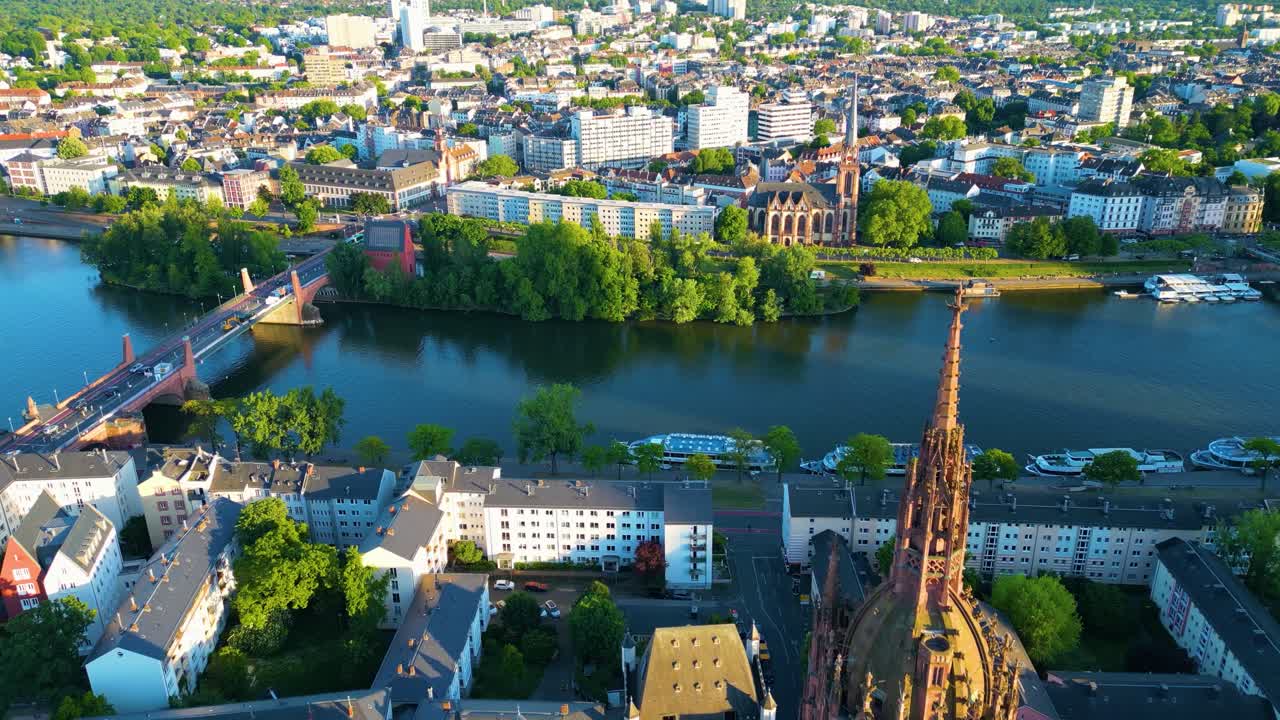 4K Drone Video of the Gothic-Style Kaiserdom St. Bartholomäus Cathedral and Evangelische Dreikönigskirche Church on the Main River in Downtown Frankfurt, Germany