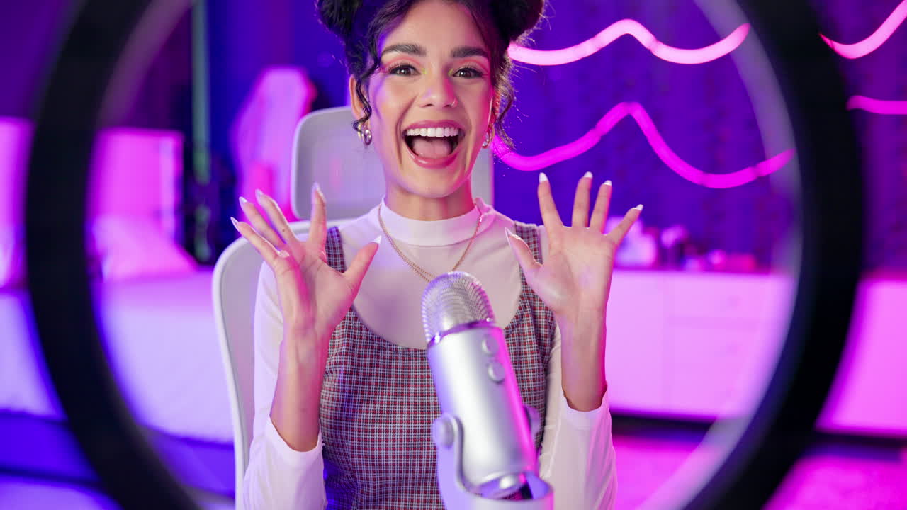 A woman is recording into a microphone