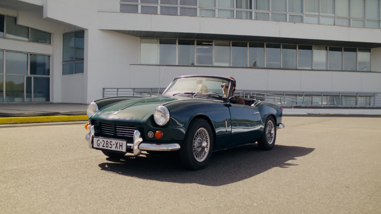 Couple in a vintage convertible