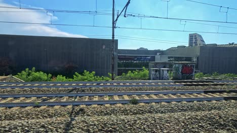 scenic train ride showcasing milan's architecture and greenery