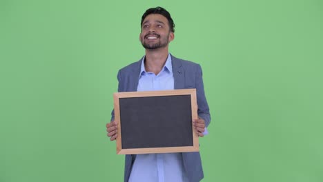young handsome bearded persian businessman in suit