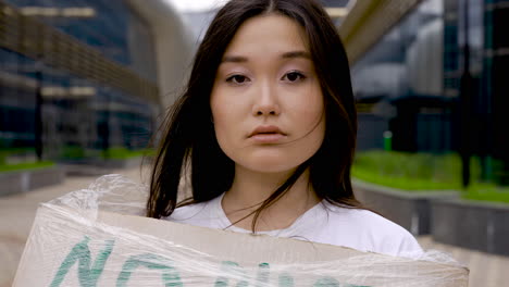 close up of an girl wrapped in plastic film