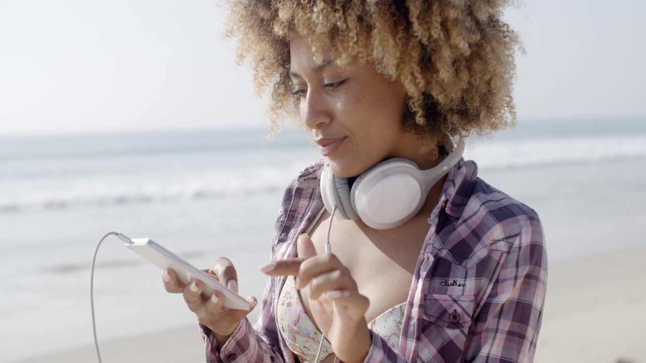 Girl On Beach Listening To Music