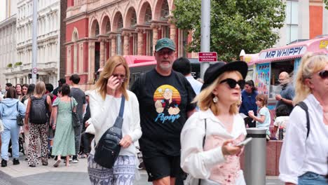 people walking near museum on a busy day