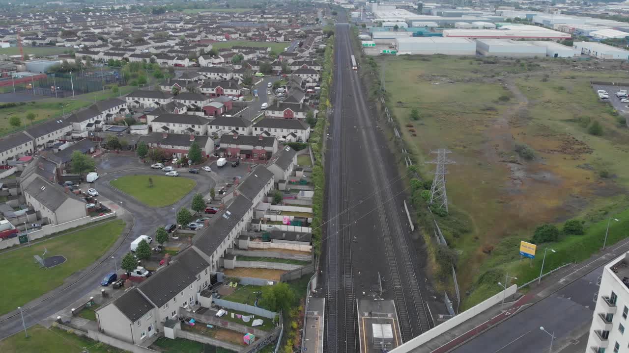 Train passing by cherry orchard estate at Park West Dublin Ireland aerial