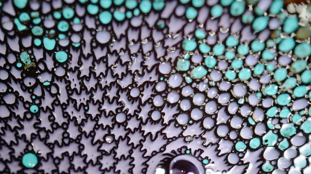 Abstract macro shot of colorful liquids mixing, forming intricate patterns and textures