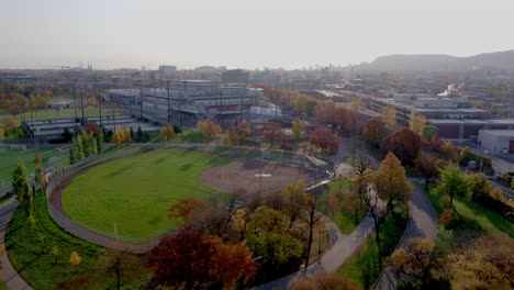 Aerial-shot-of-a-baseball-field-in-a-public-parc-on-a-autumn-sunny-morning-in-Montreal