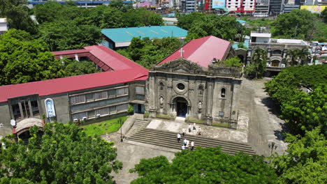 aerial shot of men going up to nuestra senora parish church in makati