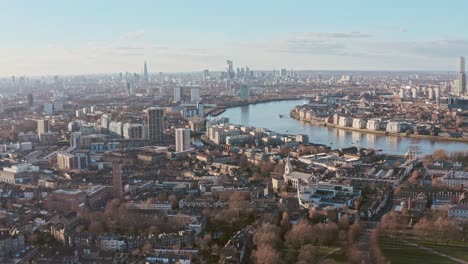 drone shot towards central london skyline from greenwich at sunset