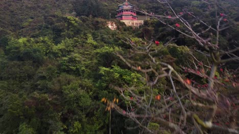 forward climbing drone reveal of a red temple in hong kong