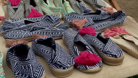 right gimbal shot of handmade espadrilles at flea market